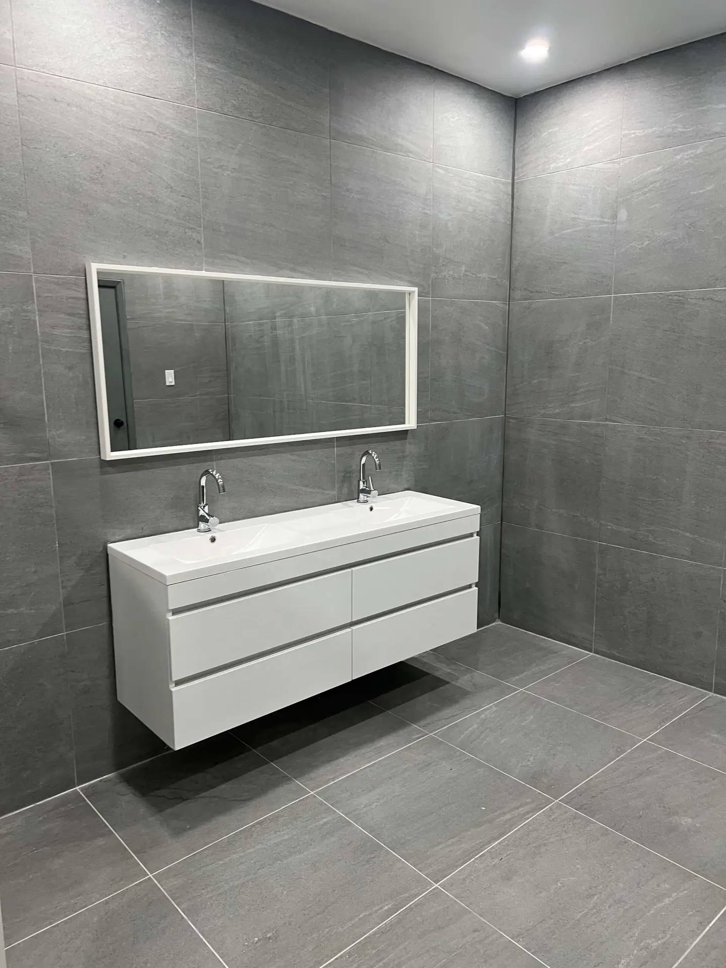 Finished bathroom renovation by Kodiak Construction Group