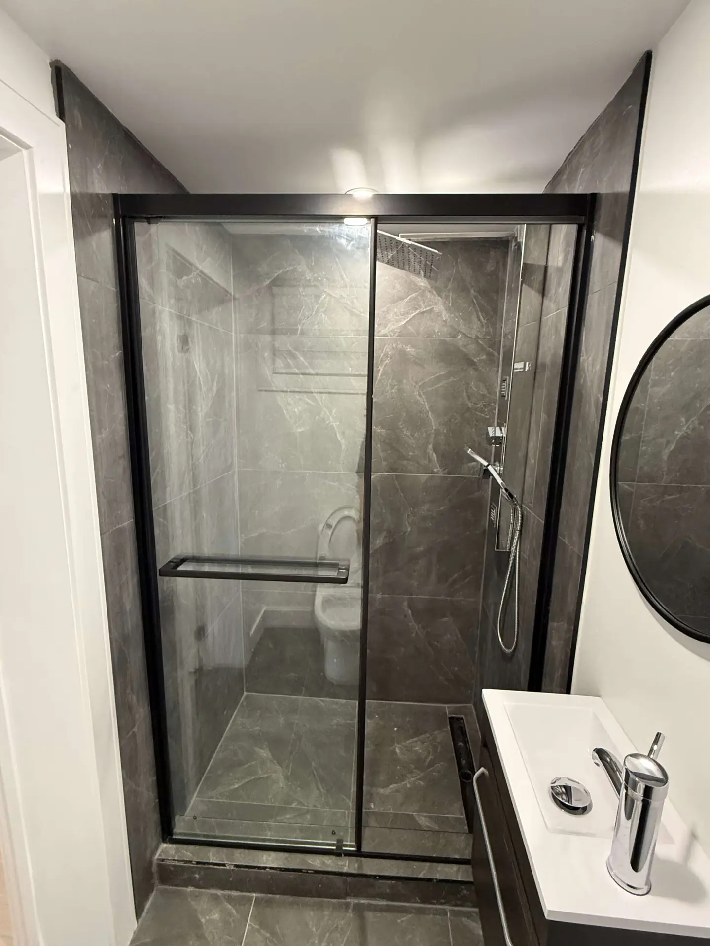Finished bathroom renovation by Kodiak Construction Group