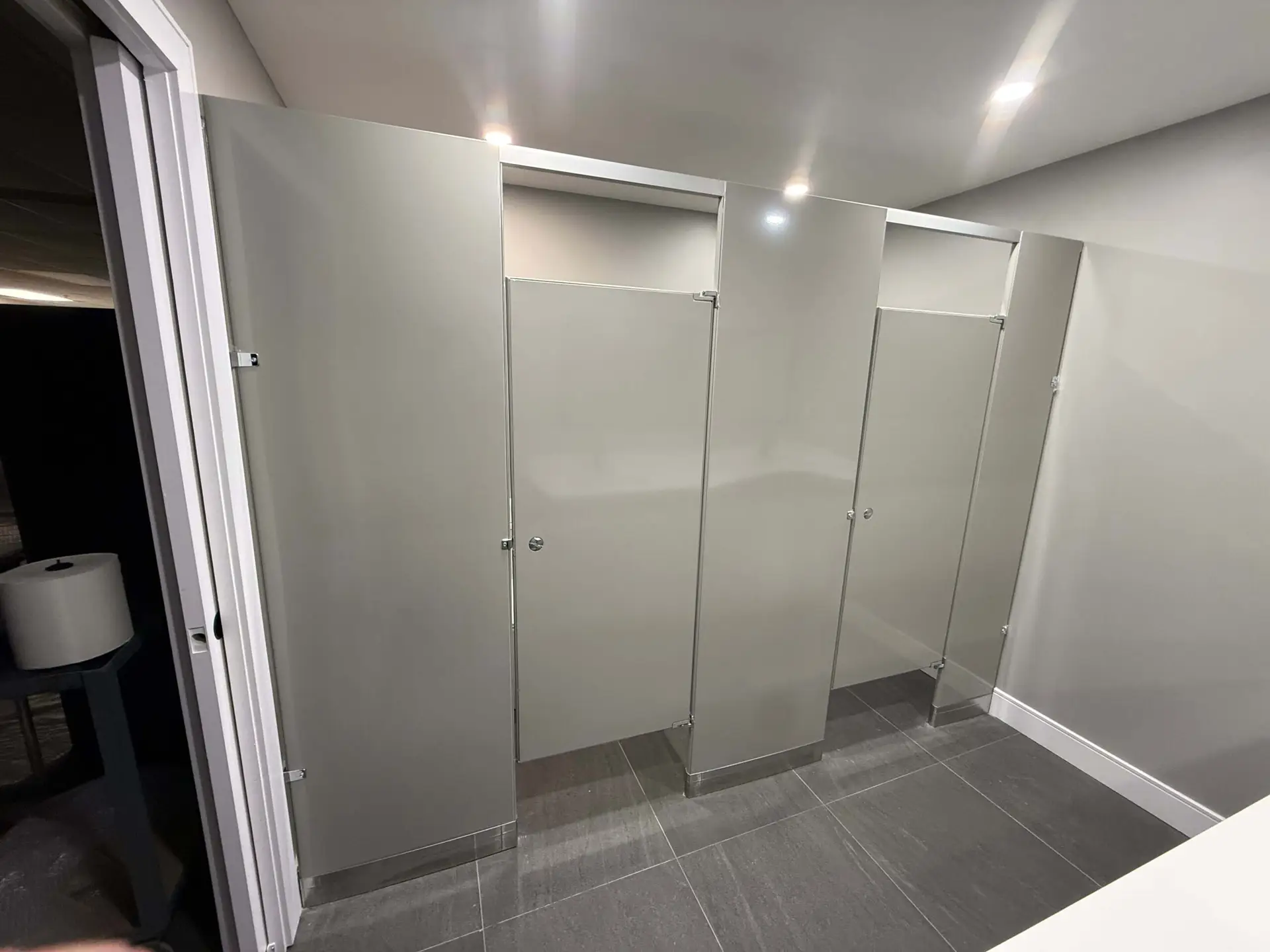 Commercial washroom partition stalls by Kodiak Construction Group