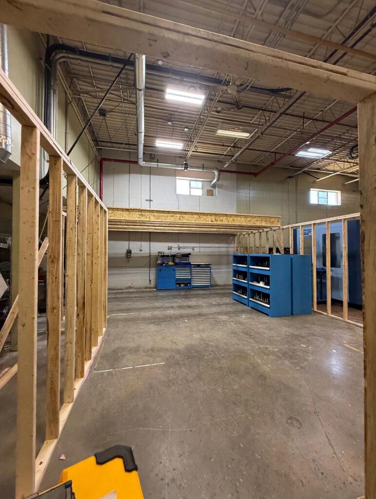 Wood stud framing walls with an LVL beam header inside a commercial building